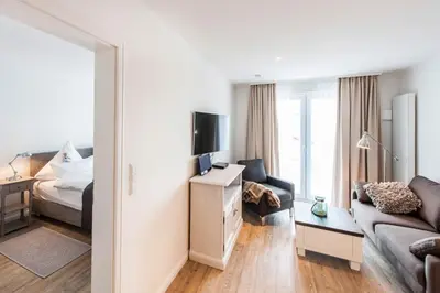 Ein Bett oder Betten in einem Zimmer der Unterkunft Weisse Villa Apartment 2 3 Deichkind