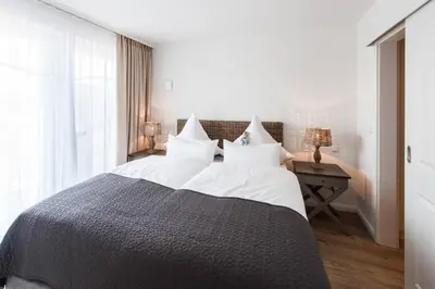 Ein Bett oder Betten in einem Zimmer der Unterkunft Weisse Villa Apartment 2 4 Estelles Beachhouse