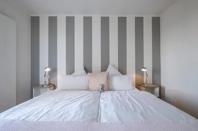 Ein Bett oder Betten in einem Zimmer der Unterkunft Weisse Villa Apartment 3 3 Sonnendeck