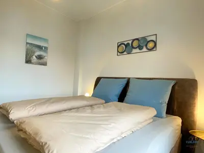 Ein Bett oder Betten in einem Zimmer der Unterkunft Strandbude 2 Döse