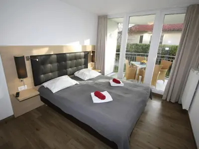 Ein Bett oder Betten in einem Zimmer der Unterkunft HP Touristik - Residenz Hohe Lith Neu 3 0
