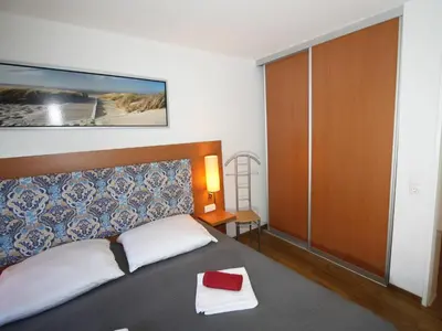 Ein Bett oder Betten in einem Zimmer der Unterkunft Residenz Hohe Lith 32