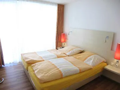 Ein Bett oder Betten in einem Zimmer der Unterkunft Residenz Hohe Lith 11