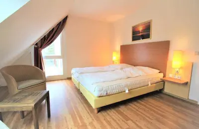 Ein Bett oder Betten in einem Zimmer der Unterkunft HP Touristik - Residenz Hohe Lith Neu 1 3