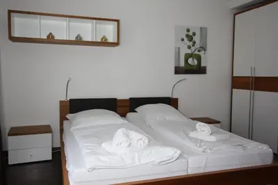 Ein Bett oder Betten in einem Zimmer der Unterkunft HP Touristik - Residenz Hohe Lith Neu 2 1