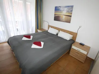 Ein Bett oder Betten in einem Zimmer der Unterkunft H&P Touristik - Residenz Hohe Lith 12