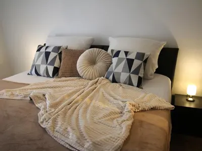 Ein Bett oder Betten in einem Zimmer der Unterkunft Residenz Steinmarne Cuxhaven 3