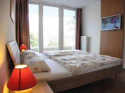 Ein Bett oder Betten in einem Zimmer der Unterkunft Residenz Hohe Lith 3 12