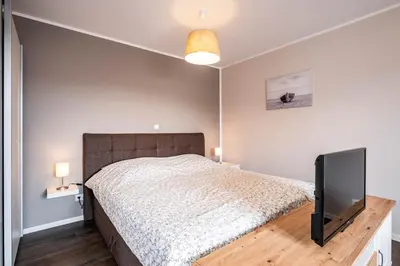 Ein Bett oder Betten in einem Zimmer der Unterkunft Haus Küstenstern Wohnung 3