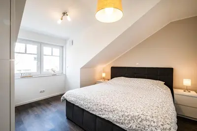 Ein Bett oder Betten in einem Zimmer der Unterkunft Haus Küstenstern Wohnung 4