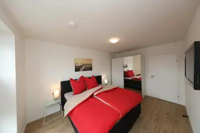 Ein Bett oder Betten in einem Zimmer der Unterkunft Ferienwohnung Quartier Hohe Geest 20 - Sahlenburg - a69835