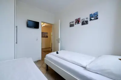 Ein Bett oder Betten in einem Zimmer der Unterkunft Strandhochhaus SA12