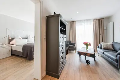 Ein Bett oder Betten in einem Zimmer der Unterkunft Weisse Villa Apartment 1 3 Nord