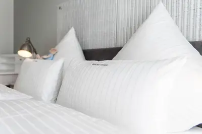 Ein Bett oder Betten in einem Zimmer der Unterkunft Weisse Villa Apartment 1 3 Nord