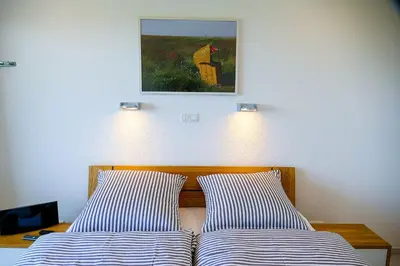 Ein Bett oder Betten in einem Zimmer der Unterkunft Am Sahlenburger Strand AS05