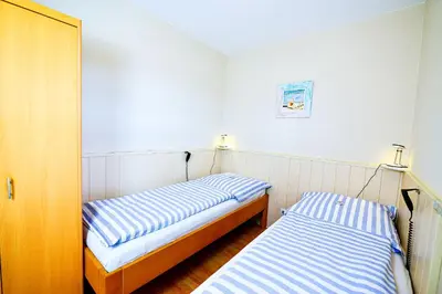 Ein Bett oder Betten in einem Zimmer der Unterkunft Am Sahlenburger Strand AS12