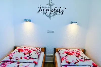 Ein Bett oder Betten in einem Zimmer der Unterkunft Am Sahlenburger Strand AS16