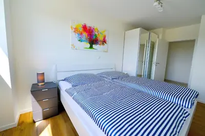 Ein Bett oder Betten in einem Zimmer der Unterkunft Haus Hohe Geest HG10