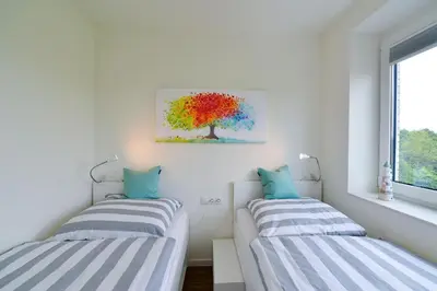 Ein Bett oder Betten in einem Zimmer der Unterkunft Haus Hohe Geest HG25