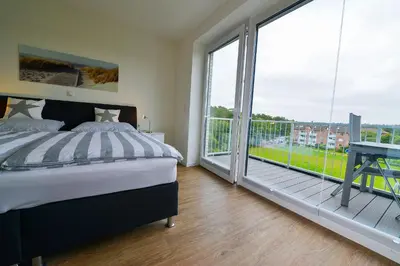 Ein Bett oder Betten in einem Zimmer der Unterkunft Haus Hohe Geest HG25