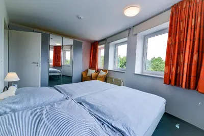 Ein Bett oder Betten in einem Zimmer der Unterkunft Haus Nordseebrandung NA34