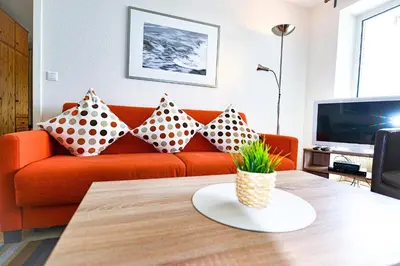 Ein Sitzbereich in der Unterkunft Haus Nordseebrandung NA44