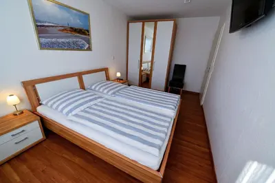 Ein Bett oder Betten in einem Zimmer der Unterkunft Haus Nordseebrandung NA61