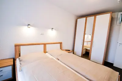 Ein Bett oder Betten in einem Zimmer der Unterkunft Haus Nordseebrandung NB42