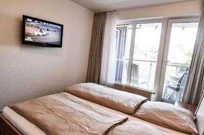 Ein Bett oder Betten in einem Zimmer der Unterkunft Haus Nordseebrandung NB42