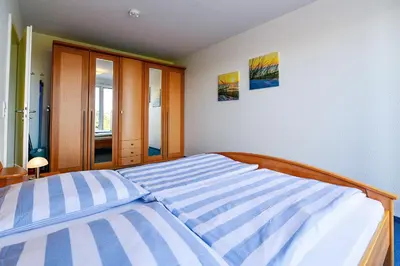 Ein Bett oder Betten in einem Zimmer der Unterkunft Haus Nordseebrandung NA72