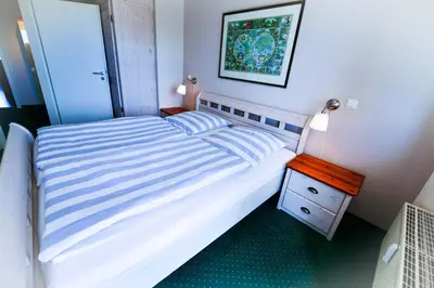 Ein Bett oder Betten in einem Zimmer der Unterkunft Haus Nordseebrandung NB45