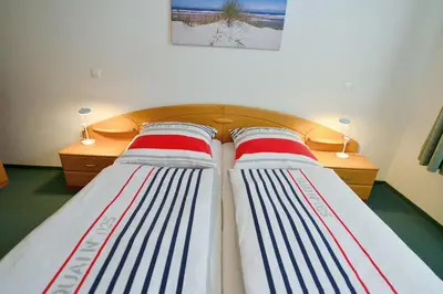 Ein Bett oder Betten in einem Zimmer der Unterkunft Haus Nordseebrandung NB51