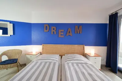 Ein Bett oder Betten in einem Zimmer der Unterkunft Haus Nordseebrandung ND53