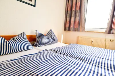 Ein Bett oder Betten in einem Zimmer der Unterkunft Haus Seewind HS15