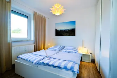 Ein Bett oder Betten in einem Zimmer der Unterkunft Haus Seewind HS18