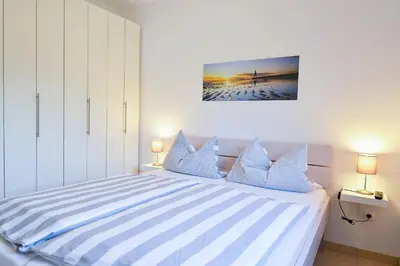Ein Bett oder Betten in einem Zimmer der Unterkunft Haus Seewind HS13