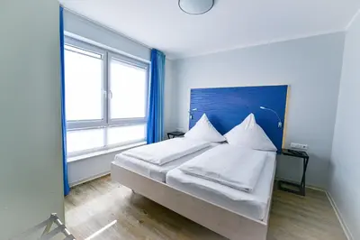 Ein Bett oder Betten in einem Zimmer der Unterkunft Beach Lodge BL03