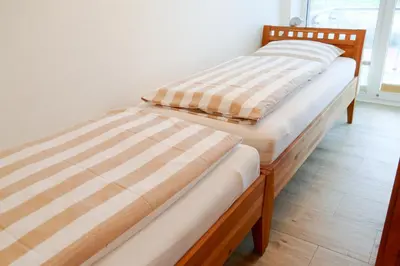 Ein Bett oder Betten in einem Zimmer der Unterkunft Haus Nordseebrandung NC31