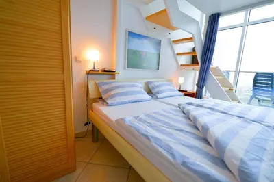 Ein Bett oder Betten in einem Zimmer der Unterkunft Haus Nordseebrandung NC73