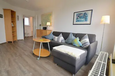 Ein Sitzbereich in der Unterkunft Haus Nordseebrandung NC75