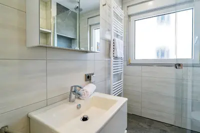 Ein Badezimmer in der Unterkunft Strandhochhaus SJ04