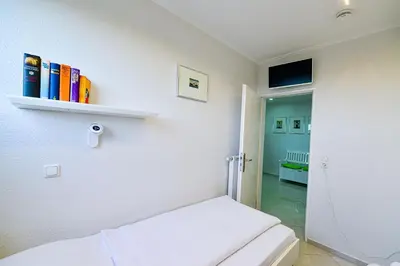 Ein Bett oder Betten in einem Zimmer der Unterkunft Strandhochhaus SJ10