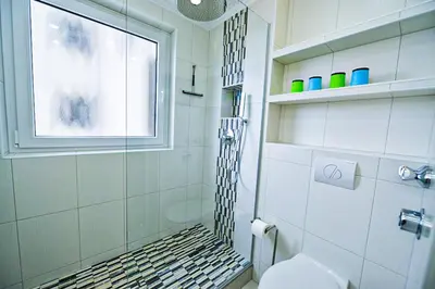 Ein Badezimmer in der Unterkunft Strandhochhaus SJ10