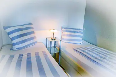 Ein Bett oder Betten in einem Zimmer der Unterkunft Strandhochhaus SHB1