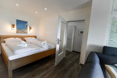 Ein Bett oder Betten in einem Zimmer der Unterkunft Strandhochhaus SB13