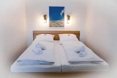 Ein Bett oder Betten in einem Zimmer der Unterkunft Strandhochhaus SB13