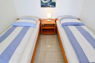 Ein Bett oder Betten in einem Zimmer der Unterkunft Strandhochhaus SC13