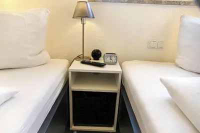 Ein Bett oder Betten in einem Zimmer der Unterkunft Strandhochhaus SJ09