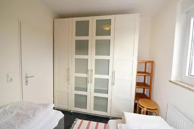 Ein Bett oder Betten in einem Zimmer der Unterkunft Strandhochhaus SD12