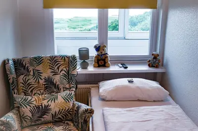 Ein Bett oder Betten in einem Zimmer der Unterkunft Strandhochhaus SG04
